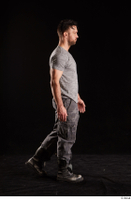  Larry Steel  1 boots dressed grey camo trousers grey t shirt shoes side view walking whole body 0002.jpg